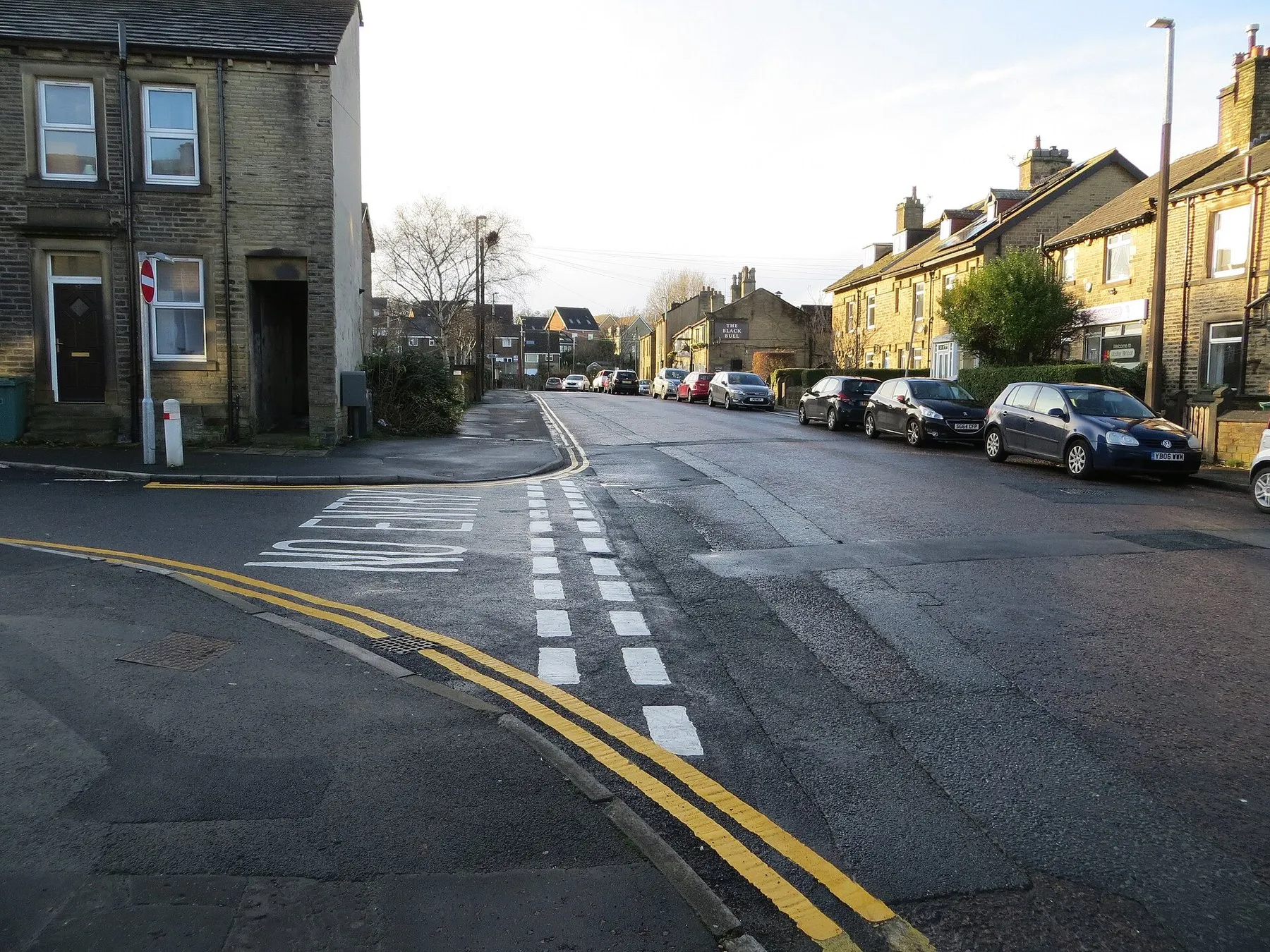 Stone terraced houses on West Street in Lindley, Huddersfield